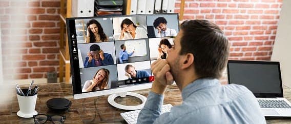 A person talking on a video call where all the participants look exhausted
